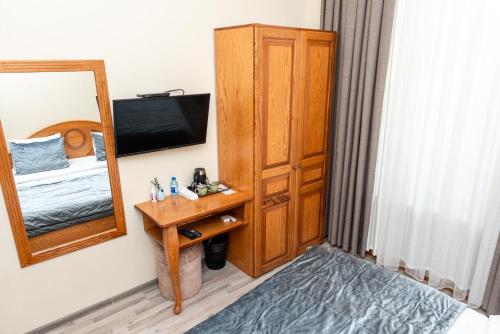 Ένα ή περισσότερα κρεβάτια σε δωμάτιο στο Utopia Hotel Baku