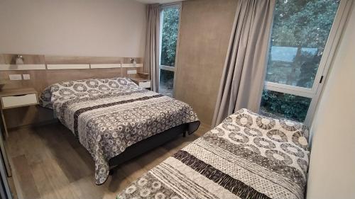 Ένα ή περισσότερα κρεβάτια σε δωμάτιο στο Apart Hotel La Campiña