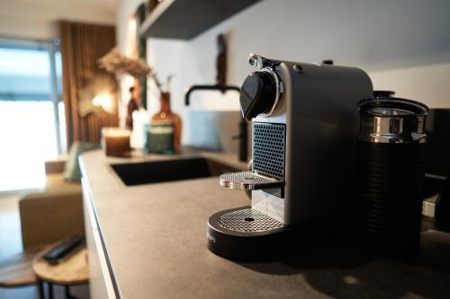 a coffee maker sitting on a counter in a kitchen at Nomad Water Studio in Harderwijk