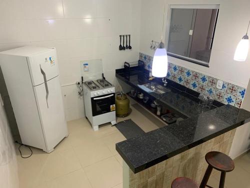 Dapur atau dapur kecil di Aloha Beach Temporada