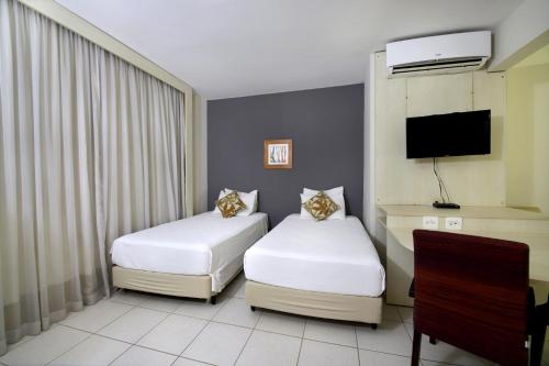 Katil atau katil-katil dalam bilik di Nobile Inn Executive Ribeirao Preto