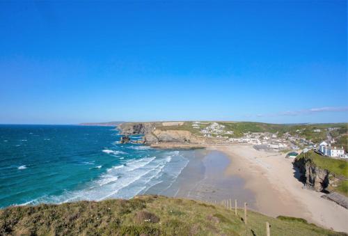 a view of a beach with the ocean at Rosebud in Portreath