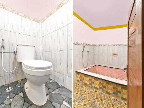 a bathroom with a toilet and a bath tub at OYO 91192 Homestay Antara in Gilimanuk