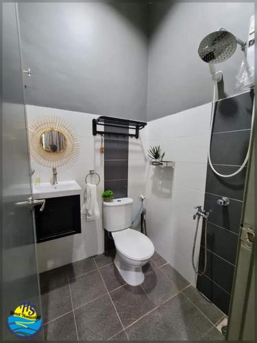 a bathroom with a toilet and a sink and a shower at Private Pool HS Sweet Homestay Kemaman in Kemaman