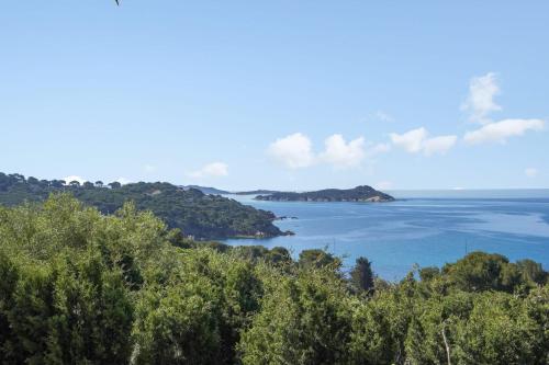 an island in the middle of a body of water at Superb apartment with loggia and view on the sea - Hyères - Welkeys in Hyères