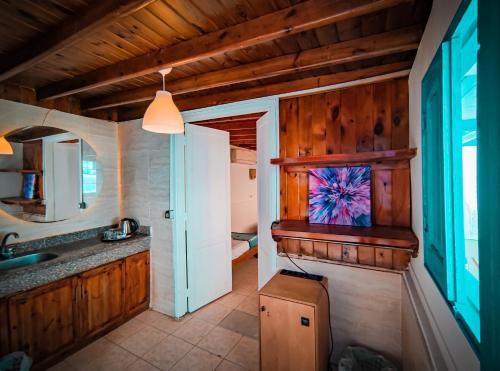 a bathroom with a sink and a mirror at Bamboo House Hotel Dahab in Dahab