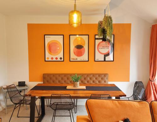 a dining room with a table and chairs at Carvetii - Phoenix House - Near Hospital, max 8 ppl in Carlisle