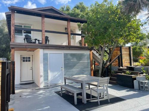 a small house with a table and a garage at Shares View Luxury Apt in Rockledge