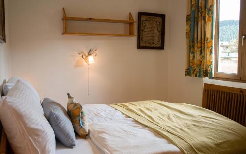 Cama o camas de una habitación en Forellenhof Appartements & Grossmutters Bungalow