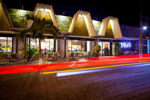 a city street at night with lots of lights at Aspira Hotel Playa del Carmen in Playa del Carmen