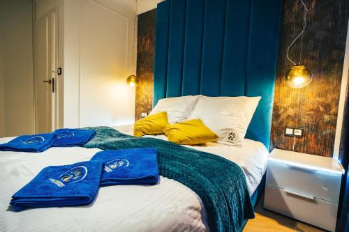 Ένα ή περισσότερα κρεβάτια σε δωμάτιο στο Apartament Rajskie na Wydmie