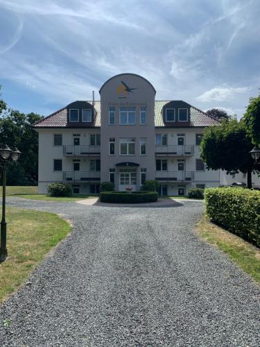 a large white building with a dome at Eldenholz FeWo8 in Waren