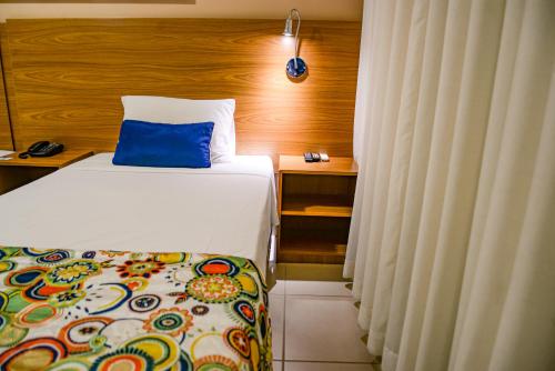 Postel nebo postele na pokoji v ubytování Comfort Hotel Bauru