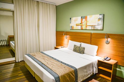 Postel nebo postele na pokoji v ubytování Comfort Hotel Bauru