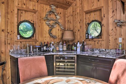 a bar in a cabin with a table and chairs at Spacious Cheriton Home 8 Mi to Cape Charles! in Cape Charles