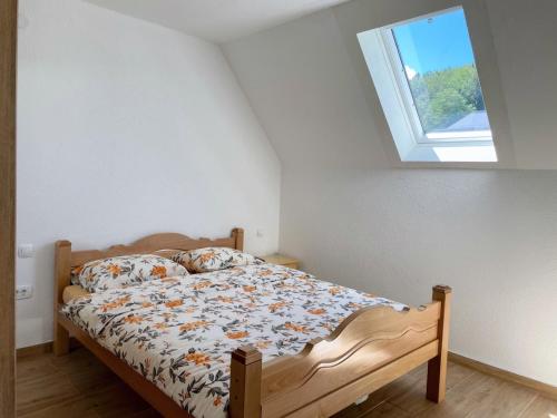 a bed in a room with a window at Gorštak in Žabljak