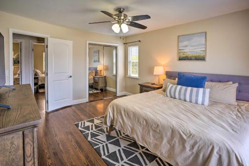 a bedroom with a bed and a ceiling fan at Quiet Anaheim Home with Pool, 5 Mi to Disney! in Anaheim