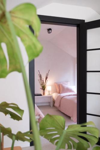 a bedroom with a mirror in front of a bed at Bosco Uno in Łagów