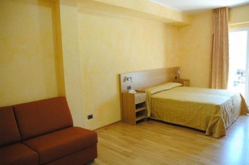 Ένα ή περισσότερα κρεβάτια σε δωμάτιο στο Residenza Fontanelle