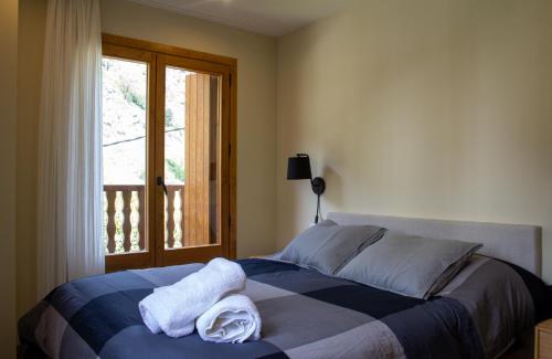 Postel nebo postele na pokoji v ubytování Apartaments Areny - L'Amfitriona