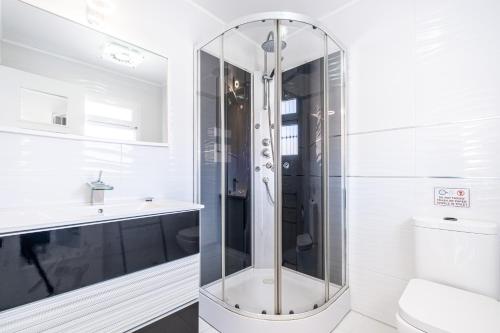 a glass shower in a bathroom with a sink at Penthouse Bella Vista in Benidorm