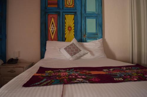 Una cama o camas en una habitación de Gran Barrio