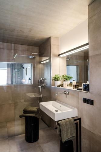 a bathroom with a sink and a mirror at Sommers "Schöne Aussicht", Adults only in Reichenbach im Vogtland