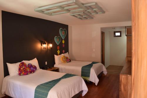 Una cama o camas en una habitación de Gran Barrio
