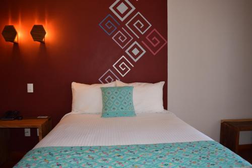 Una cama o camas en una habitación de Gran Barrio