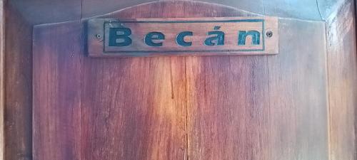 a wooden door with a sign that reads bearna at Hotel yaakunah in Escárcega