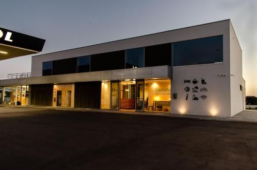 a large white building with writing on the side of it at Marinhas Bed & Breakfast in Esposende