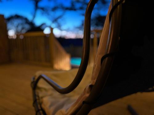 a close up of a chair on a porch at Aladdin Safari Tent in Tenby