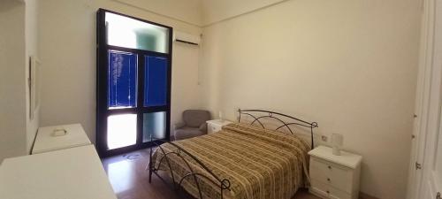 מיטה או מיטות בחדר ב-Casa Lucia