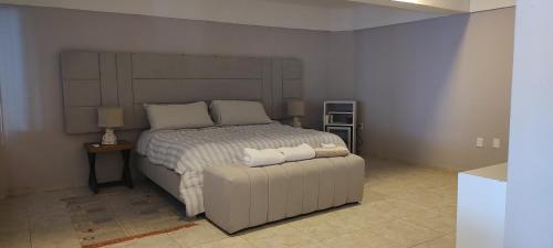 Postel nebo postele na pokoji v ubytování Hermoso Departamento en Cozumel, con vista al mar caribe C9