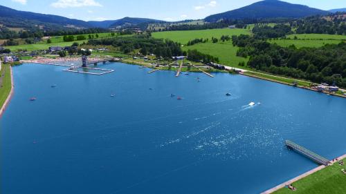 an aerial view of a lake with boats in it at Aparthotel Apartamenty Czarna Góra 310 in Sienna