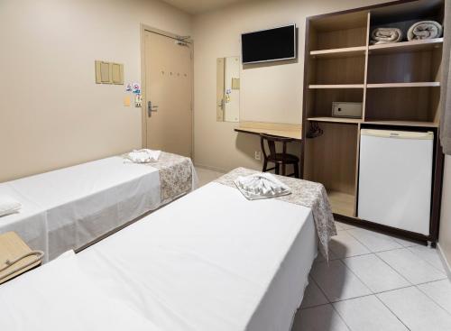 Katil atau katil-katil dalam bilik di Hotel Pitol