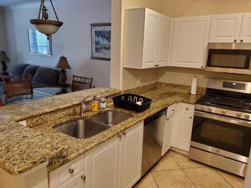 a kitchen with a sink and a stove at Baywatch in Clearwater