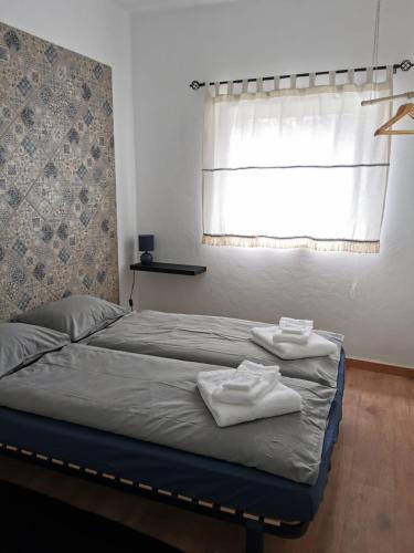 Ένα ή περισσότερα κρεβάτια σε δωμάτιο στο O Refúgio