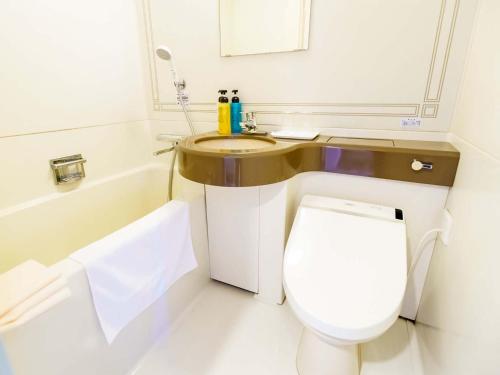 a bathroom with a toilet and a sink at City Hotel Air Port in Prince - Vacation STAY 80789v in Izumi-Sano