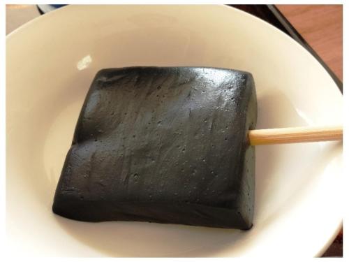 a wooden stick in a bowl with a black object at Tohoku Onsen - Vacation STAY 08516v in Towada
