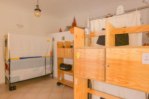 a room with two bunk beds in a room at Ostello Exclusive Dependance - IT CLOSES AT NINE PM in Palermo