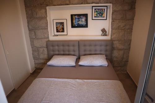 Ένα ή περισσότερα κρεβάτια σε δωμάτιο στο Dorian