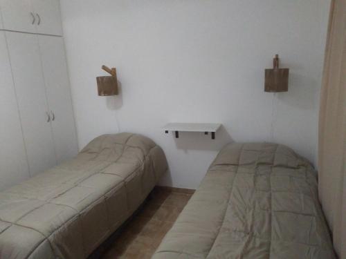 Postel nebo postele na pokoji v ubytování Complejo La Carlota