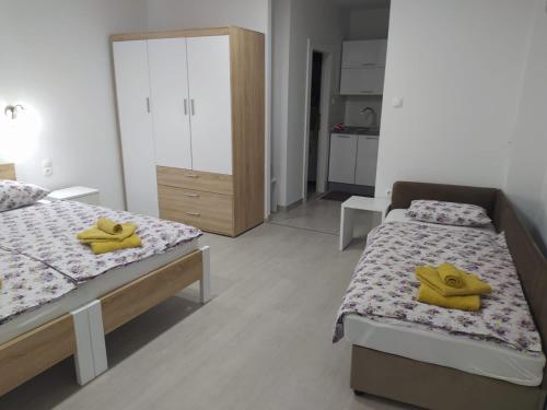 Cama o camas de una habitación en Apartman Markešić 3