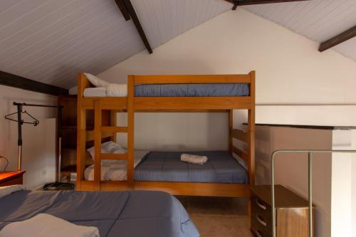 a bedroom with two bunk beds in a attic at BH Studios Hotel Brás in Sao Paulo