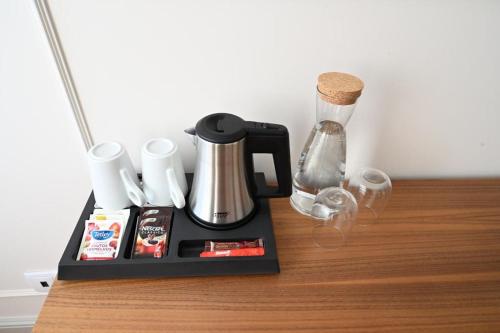 a black coffee maker sitting on a table at 6/4 de Lamego in Lamego