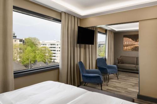 Ένα ή περισσότερα κρεβάτια σε δωμάτιο στο Radisson Blu Marina Palace Hotel, Turku