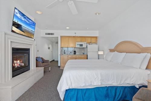 Cama o camas de una habitación en Beach House Inn & Suites