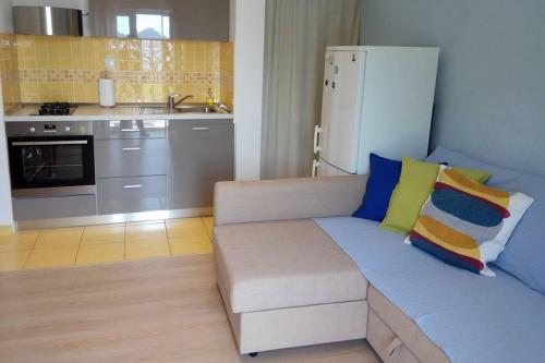 a living room with a couch and a kitchen at Apartments by the sea Sobra, Mljet - 4936 in Babino Polje