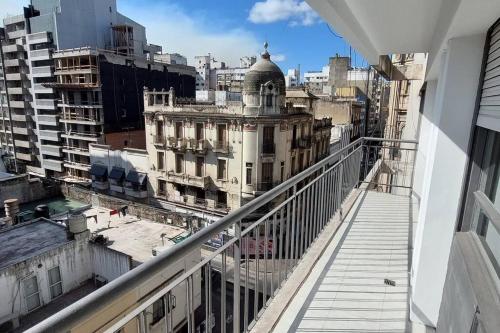 a view of a city from the balcony of a building at A metros del Parana - Centro in Rosario